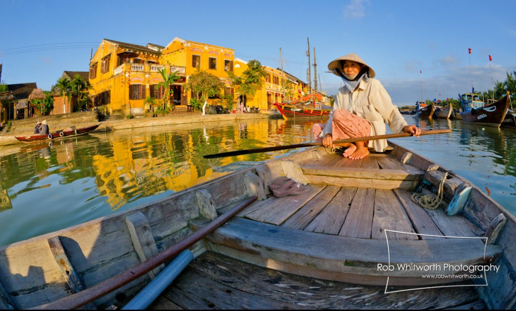 Woman in Conical Hat Rowing on Thu Bon River, Hoi An, Vietnam