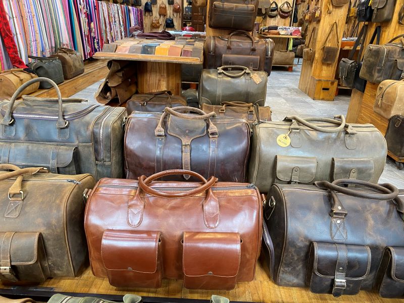 Leather bags show the different types of leather, thick buffalo hide and the softer cow hide