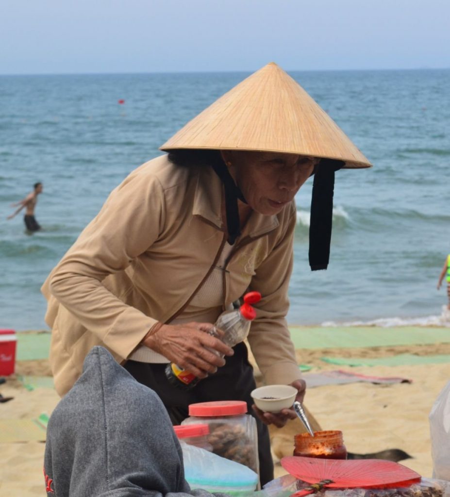 An Bang Beach Hoi An. Woman selling food and drink