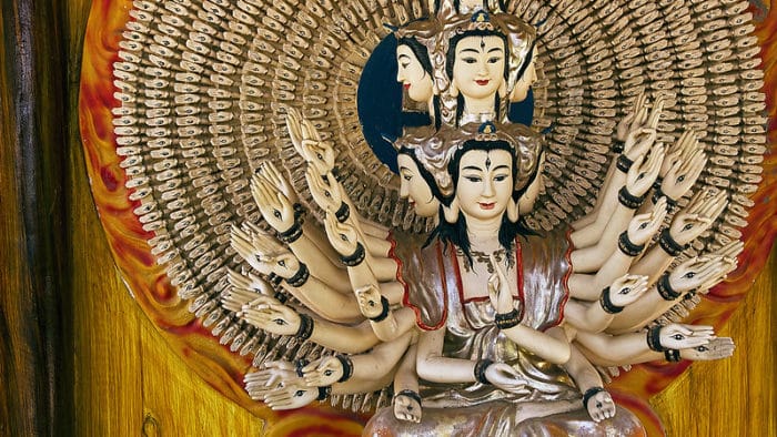Shiva sits in her golden shrine, Marble Mountains, Da Nang.