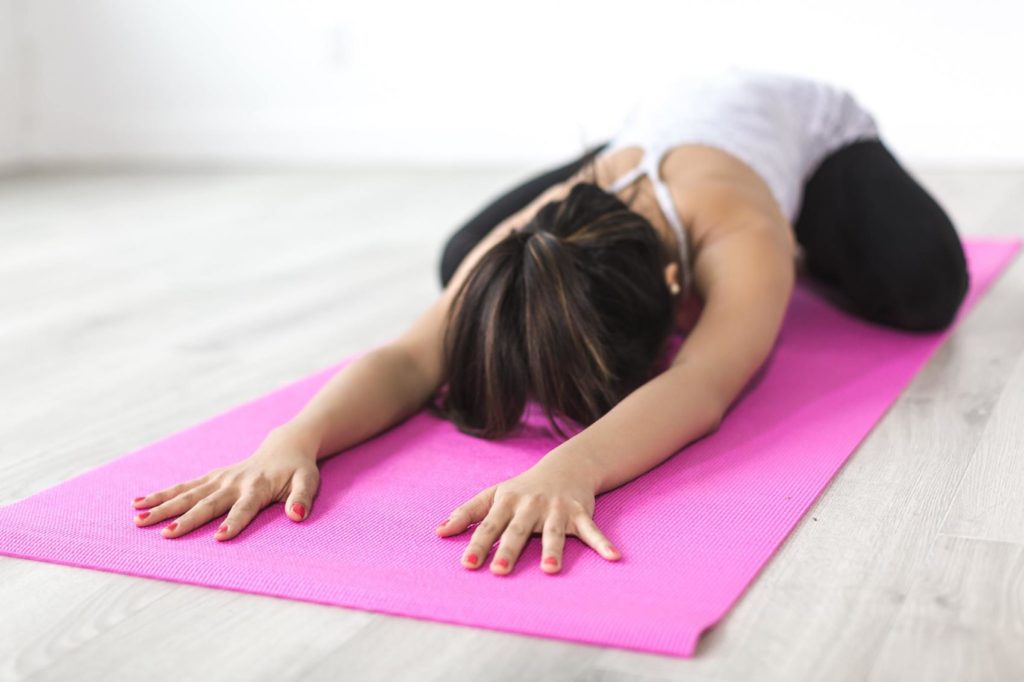 Image of a girl doing Child Pose in yoga