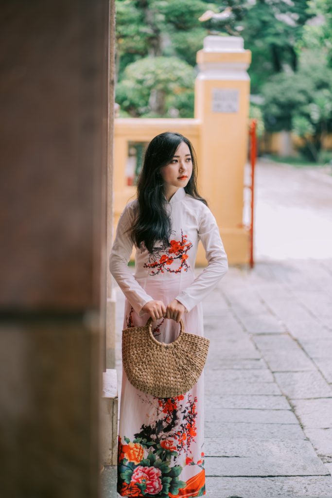 Lady in ao dai with basket