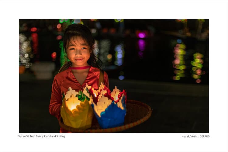 Child with lanterns at Hoi An Lantern Festival