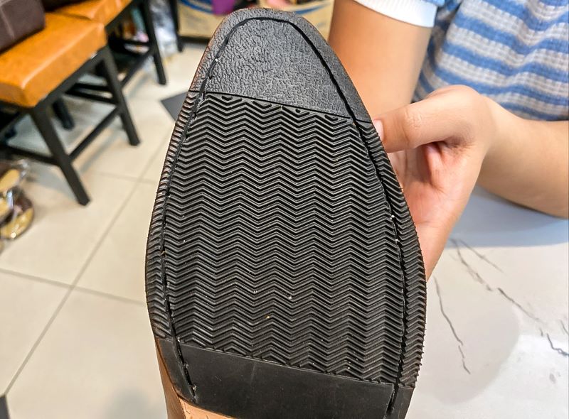 Close on the sole of a handmade shoe displays the stitching which is important to have in handmade shoes